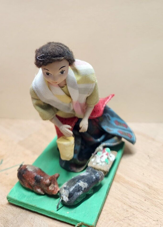 Vintage folk art doll feeding the pigs 4"