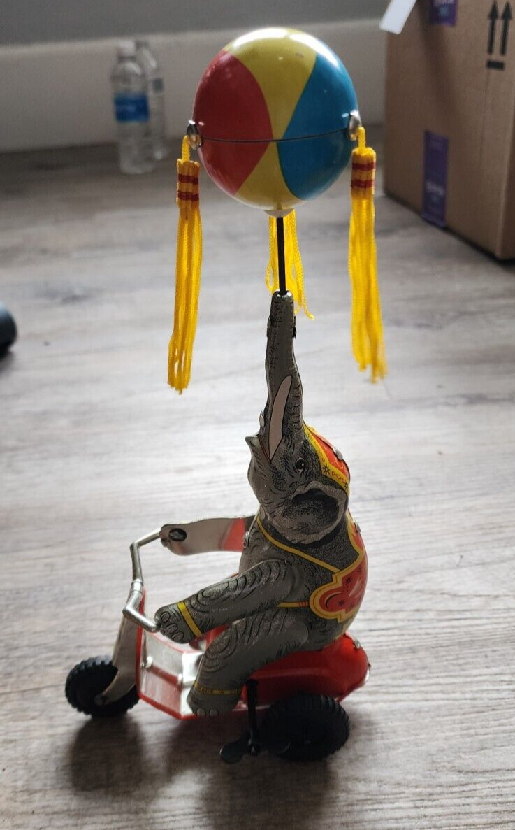 Elephant On Bike Wind-Up Tin Toy