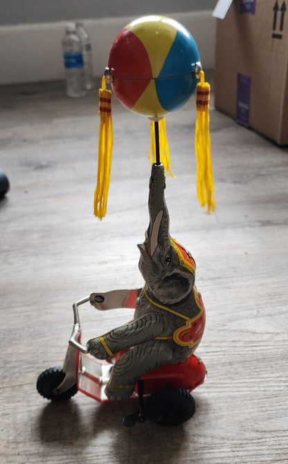 Elephant On Bike Wind-Up Tin Toy