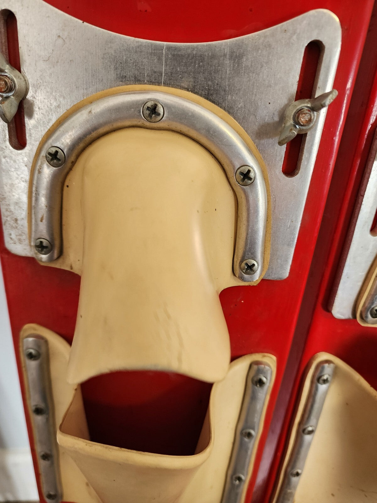 Red vintage pair of adjustable water skis