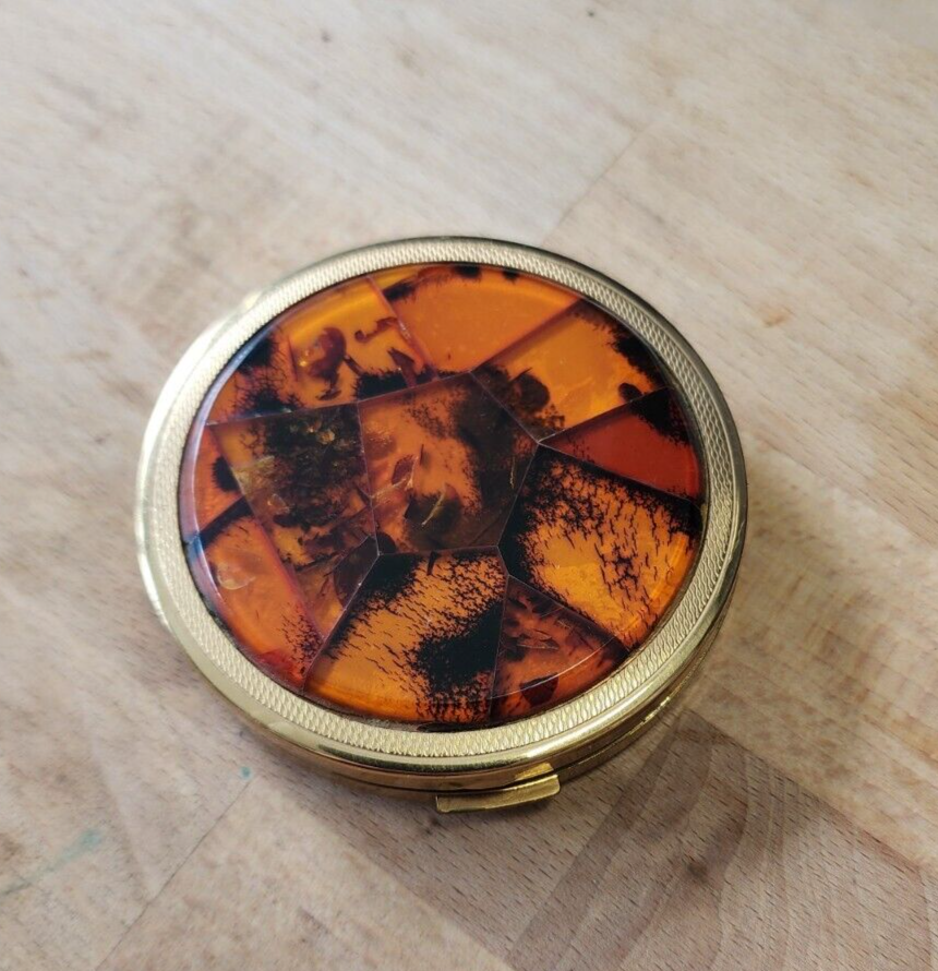Amber pocket compact
