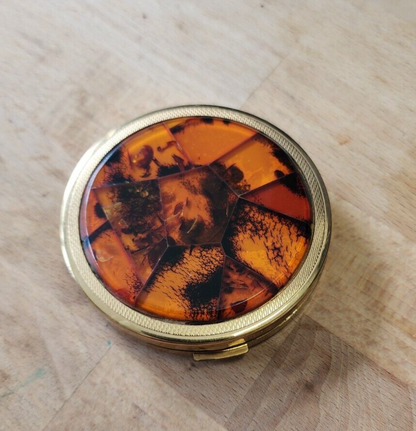 Amber pocket compact