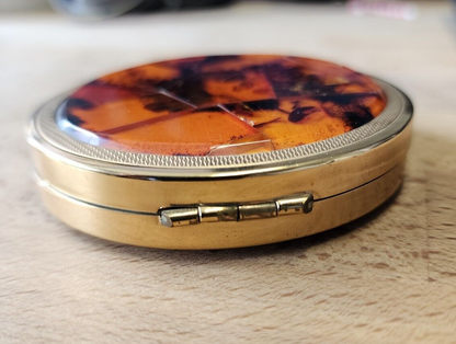 Amber pocket compact