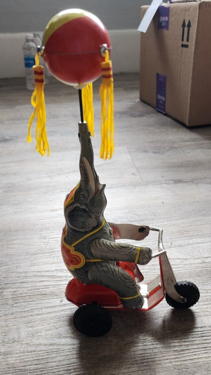 Elephant On Bike Wind-Up Tin Toy