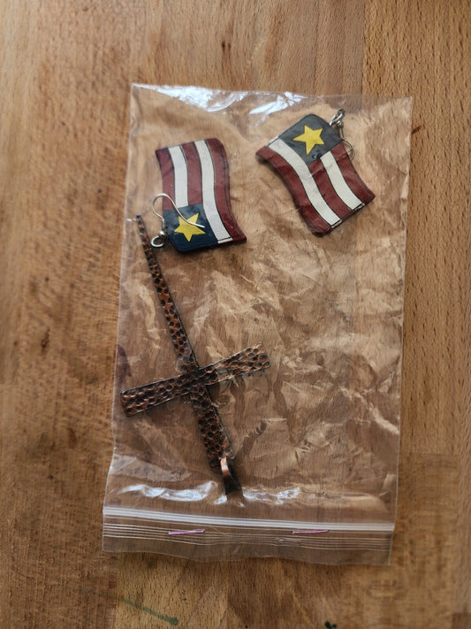 Wooden flag earrings and cross centerpiece of a necklace.