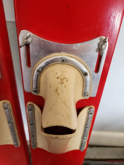 Red vintage pair of adjustable water skis