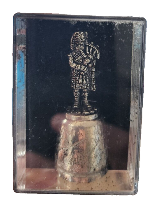Silver Thimble Made in Scotland by Northern Studios Man Holding Pipe Bags