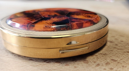 Amber pocket compact